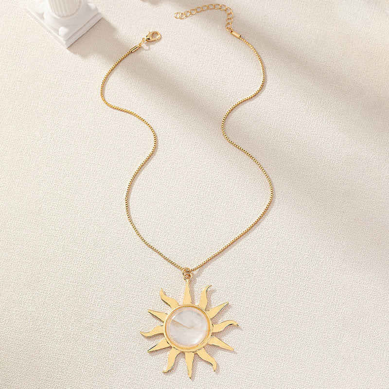 Gold statement sun pendant
