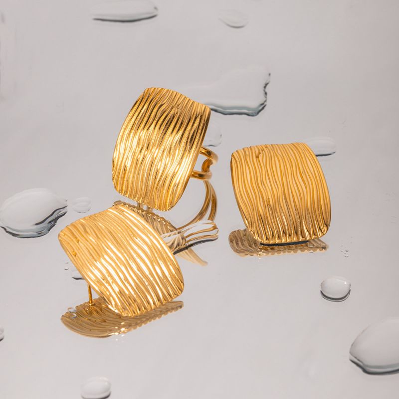 Textured studs with statement ring
