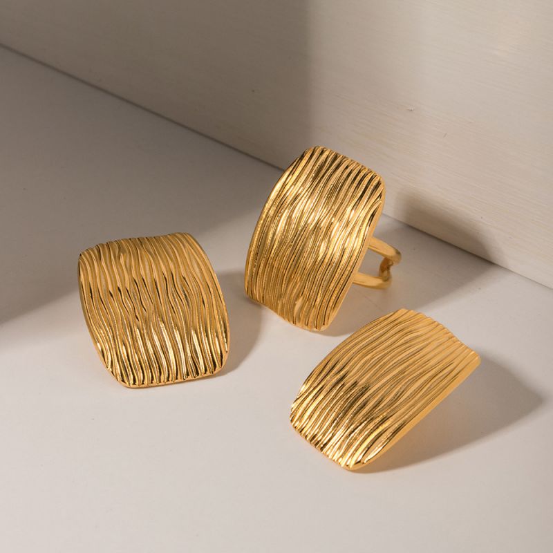 Textured studs with statement ring