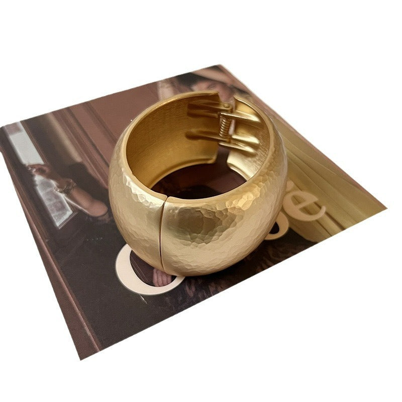 Gold textured arm candy